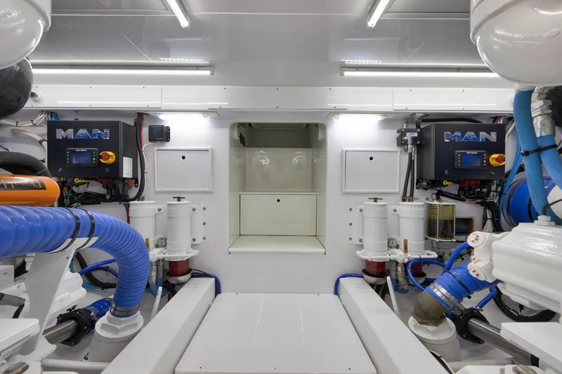 Slide: The Image of Engine room of 2003 Weaver Custom Sportfish with MAN engines and advanced filtration systems. - 51