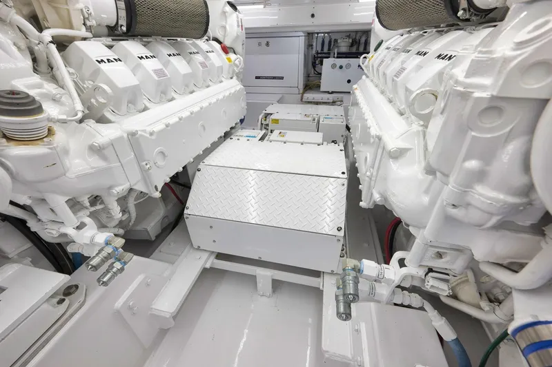 Slide: The Image of Engine room of a 2003 Weaver Custom Sportfish boat with MAN engines. - 53