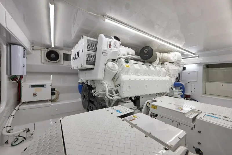 Slide: The Image of Engine room of a 2003 Weaver Custom Sportfish boat with MAN engine. - 54
