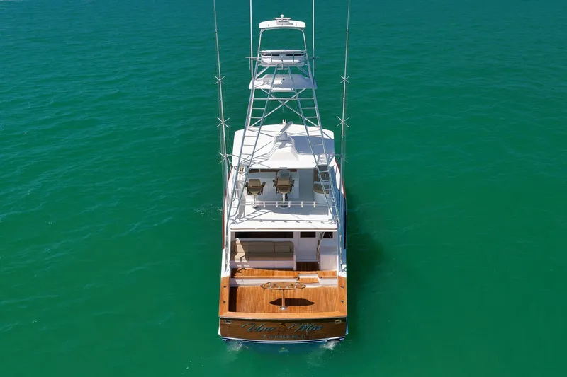 Slide: The Image of 2003 Weaver Custom Sportfish yacht on clear turquoise water, aerial view. - 6