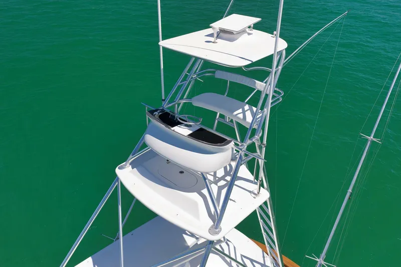 Slide: The Image of Tower view of 2003 Weaver Custom Sportfish boat against vibrant green water. - 7
