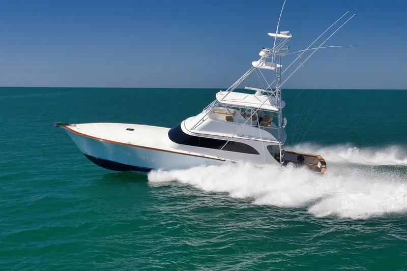 Slide: The Image of 2003 Weaver Custom Sportfish yacht cruising on open ocean waters. - 9