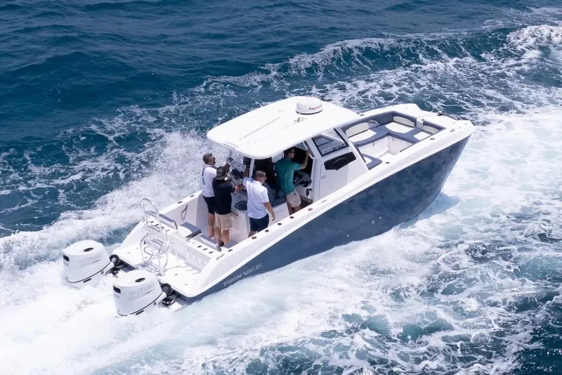 The Image of Manufacturer Provided Image: 2026 Twin Vee 260 GFX2 CC boat cruising on ocean waves with passengers onboard. - 0