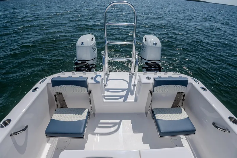 Slide: The Image of Manufacturer Provided Image: 2026 Twin Vee 260 GFX2 CC boat with dual engines on open water. - 11