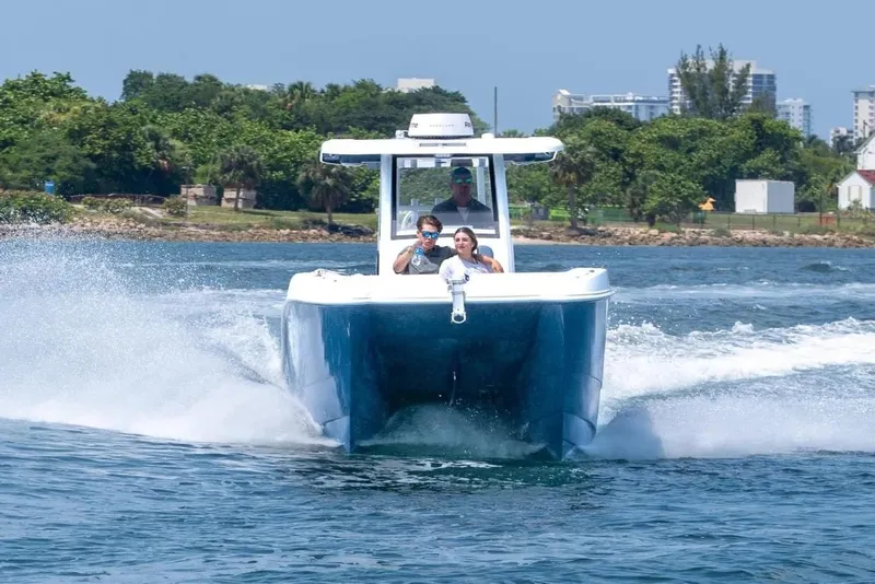 Slide: The Image of 2026 Twin Vee 260 GFX2 CC boat on the water. - 14