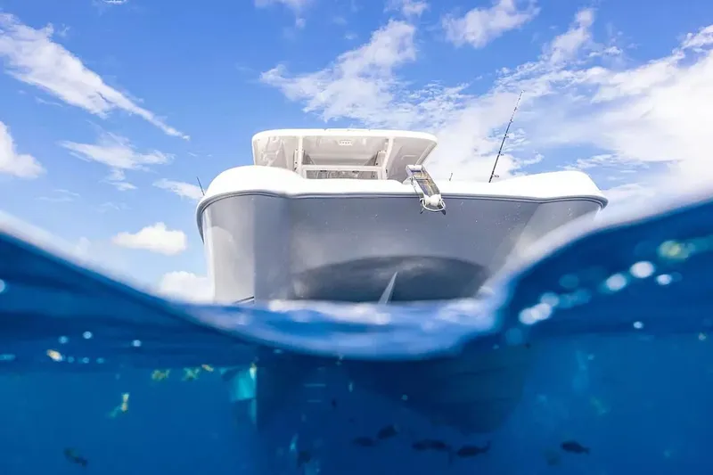 Slide: The Image of Twin Vee 260 GFX2 CC 2026 on blue sea, underwater view. - 15