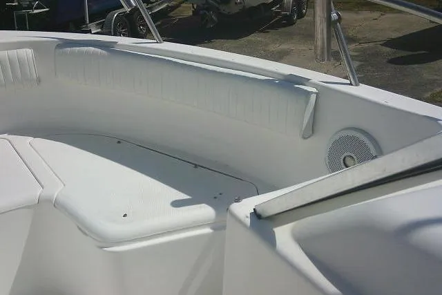 Slide: The Image of 2006 Clearwater 2200 Dual Console boat interior with white seating and speaker. - 11