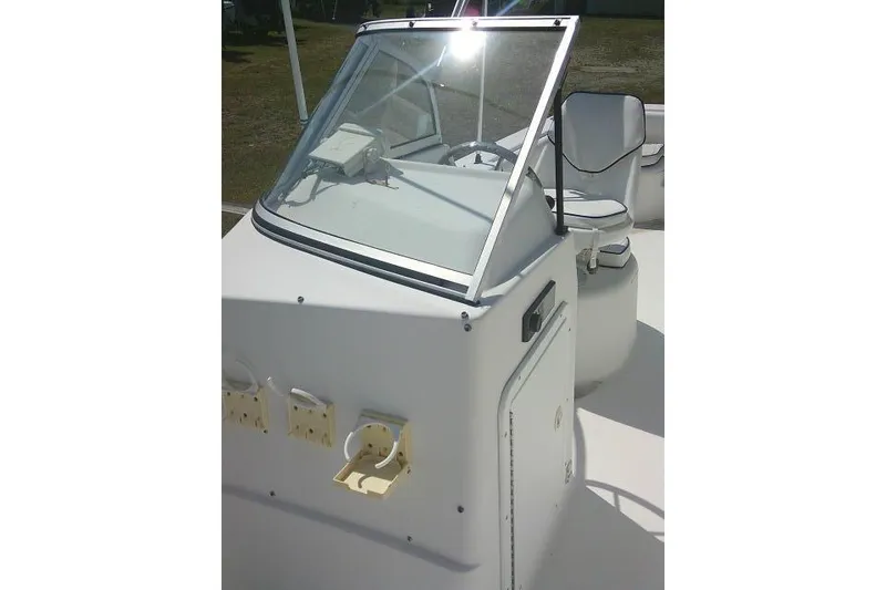 Slide: The Image of 2006 Clearwater 2200 Dual Console boat interior with windshield and seating. - 12