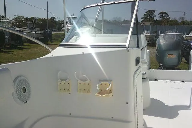 Slide: The Image of 2006 Clearwater 2200 Dual Console boat interior with dashboard and seating area. - 14