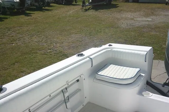 Slide: The Image of 2006 Clearwater 2200 Dual Console boat interior with white seating and open deck area. - 21