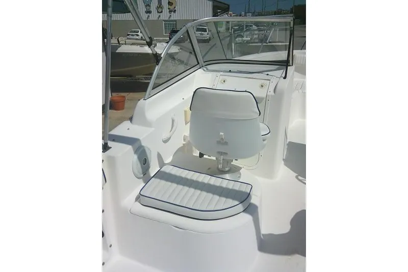 Slide: The Image of 2006 Clearwater 2200 Dual Console boat interior with seating and windshield. - 24