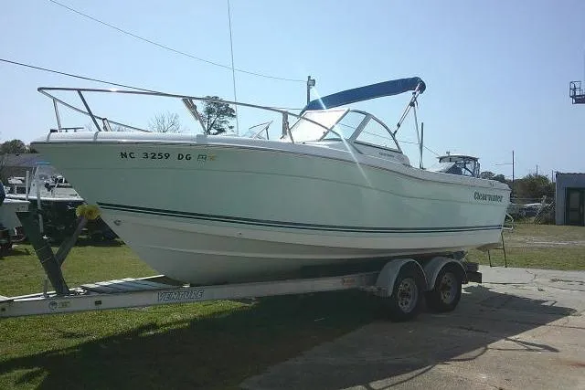 Slide: The Image of 2006 Clearwater 2200 Dual Console boat on trailer, parked outdoors. - 4