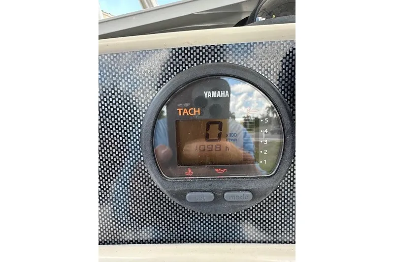 The Image of Yamaha tachometer display on 2014 Pioneer 222 Sportfish boat, showing 1098 hours. - 1