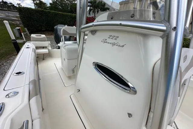 Slide: The Image of 2014 Pioneer 222 Sportfish boat interior with seating and console details. - 8