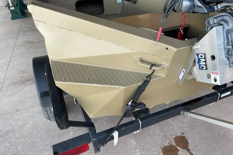 Slide: The Image of 2025 Edge Duck Boats 550 on trailer, featuring durable construction and motor mount. - 11
