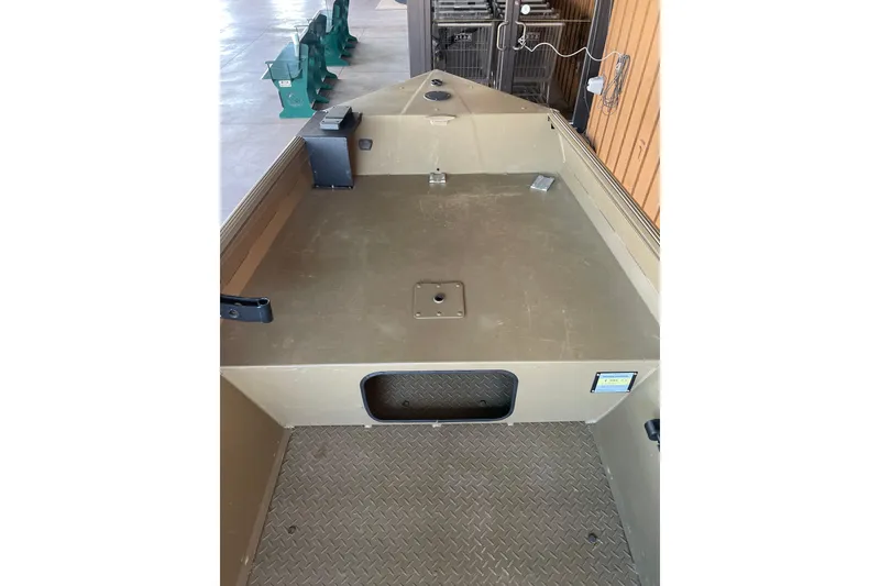 Slide: The Image of 2025 Edge Duck Boats 550 interior with spacious deck and storage compartment. - 13