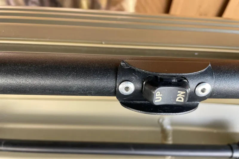 Slide: The Image of Close-up of a control switch labeled "UP" and "DN" on a 2025 Edge Duck Boats 550. - 15