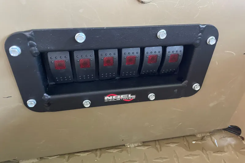 Slide: The Image of Control panel with switches on a 2025 Edge Duck Boats 550 model. - 16