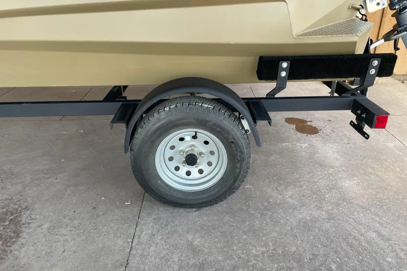 Slide: The Image of Trailer wheel of 2025 Edge Duck Boats 550 on concrete surface. - 2