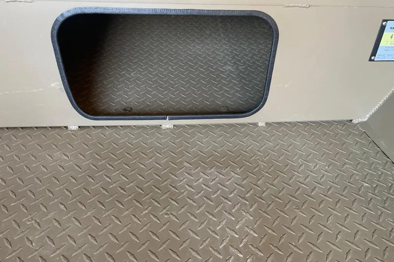 Slide: The Image of Diamond plate flooring and storage compartment in 2025 Edge Duck Boats 550. - 6