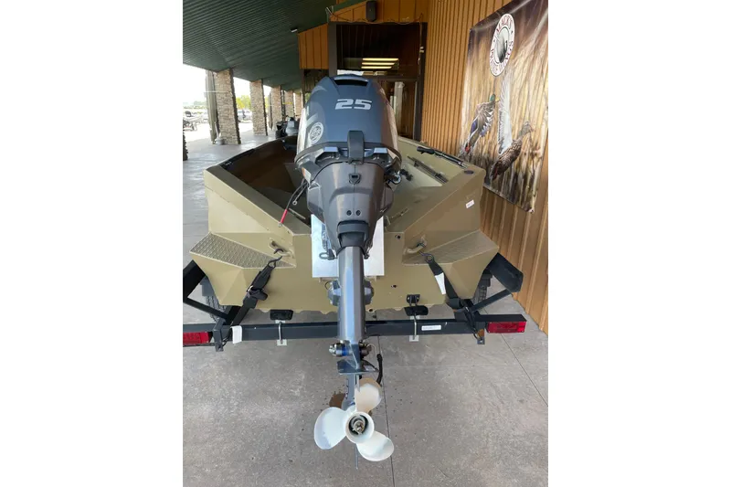 Slide: The Image of 2025 Edge Duck Boats 550 with outboard motor, displayed on a trailer. - 9