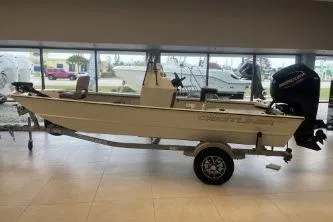 The Image of 2026 Crestliner 1860 Retriever CC boat on trailer in showroom. - 1