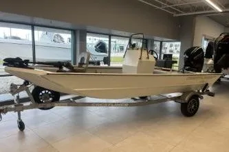 Slide: The Image of 2026 Crestliner 1860 Retriever CC boat on trailer in showroom setting. - 3