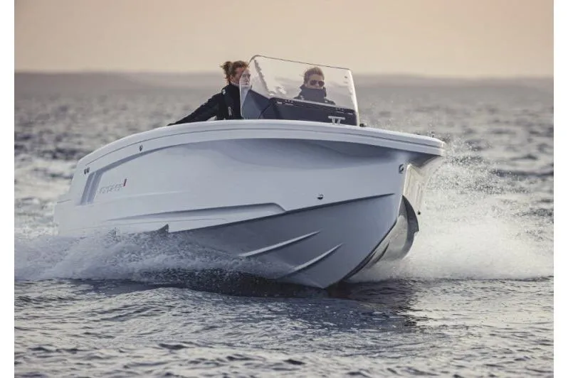 Slide: The Image of 2027 Axopar 22 Spyder cruising on open water at high speed. - 5