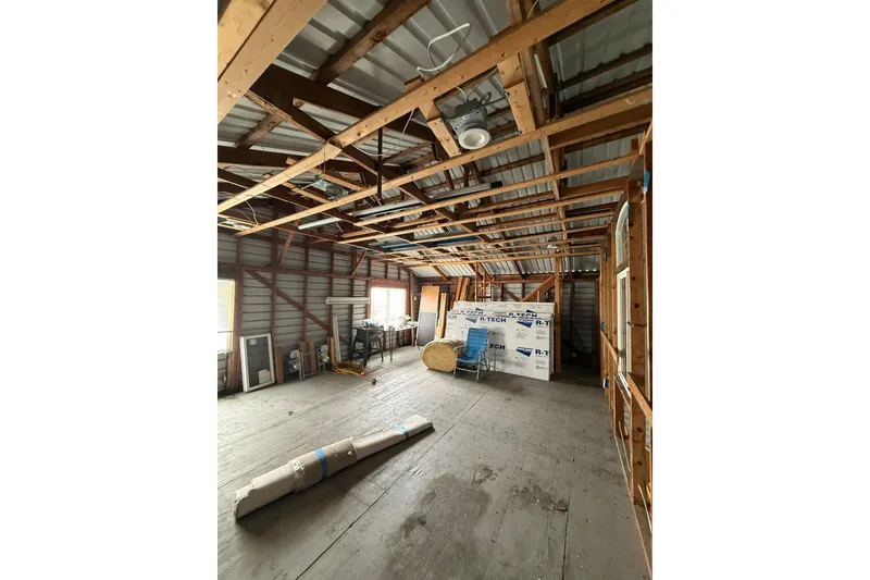 Slide: The Image of Interior of unfinished Hargraves boathouse, wooden beams, construction materials, 2008. - 10