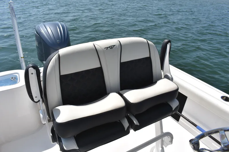 Slide: The Image of 2023 Tidewater 232 CC Adventure boat seats with ocean backdrop. - 15