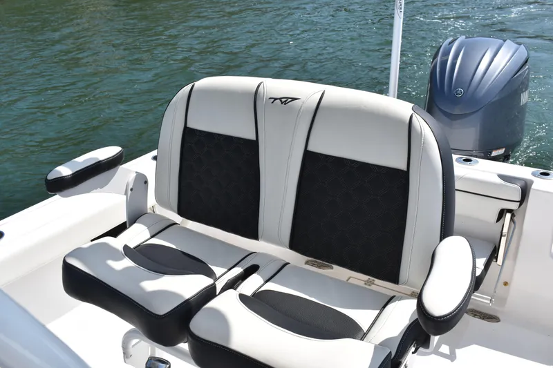 Slide: The Image of 2023 Tidewater 232 CC Adventure boat seating with stylish black and white upholstery. - 16