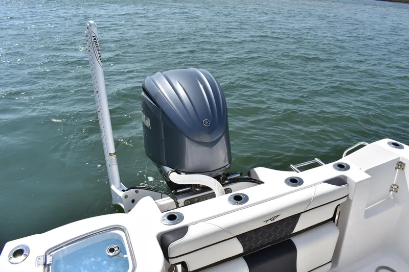 Slide: The Image of 2023 Tidewater 232 CC Adventure boat with Yamaha outboard motor on water. - 18