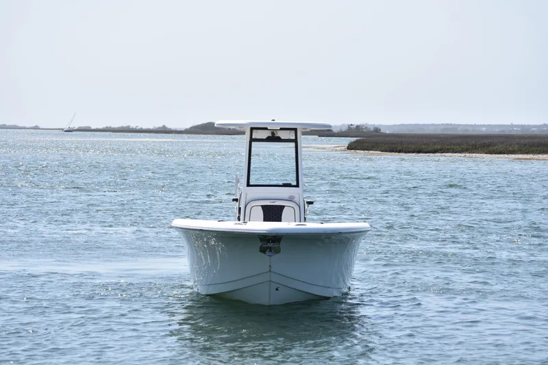 Slide: The Image of 2023 Tidewater 232 CC Adventure boat on open water, front view. - 5
