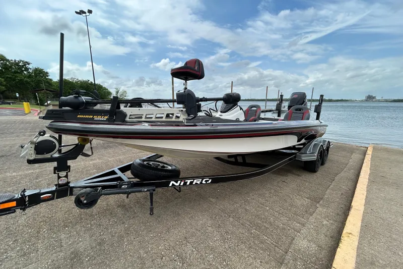 The Image of 2016 Nitro Z21 boat on trailer by waterfront, ready for launch. - 0