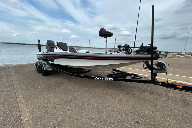 Slide: The Image of 2016 Nitro Z21 boat on trailer by waterfront, ready for launch. - 1