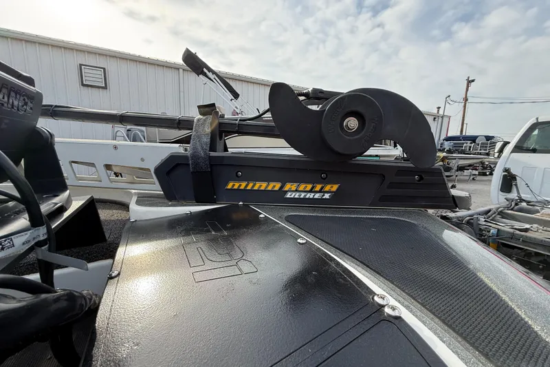 Slide: The Image of 2016 Nitro Z21 boat with Minn Kota Ultrex trolling motor, parked outdoors. - 15