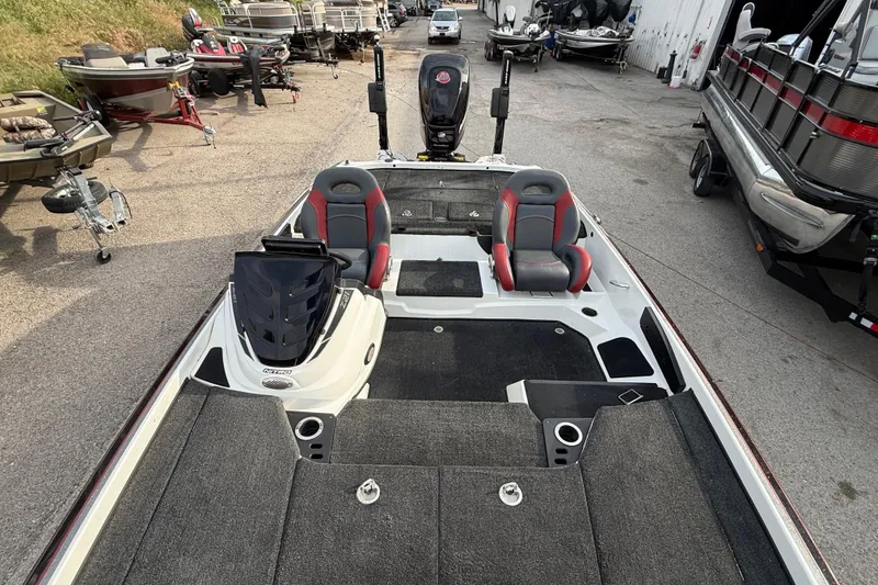 Slide: The Image of 2016 Nitro Z21 boat with dual seats, parked among other boats. - 18