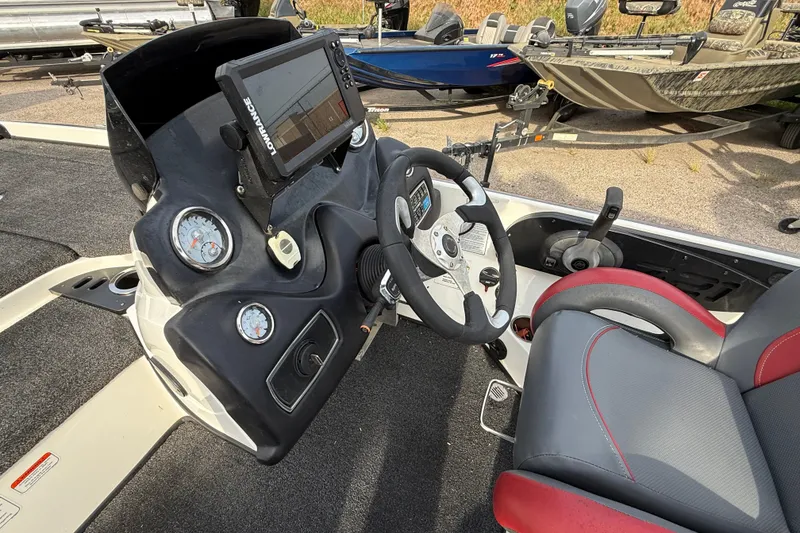 Slide: The Image of 2016 Nitro Z21 boat dashboard with steering wheel, gauges, and navigation system. - 19