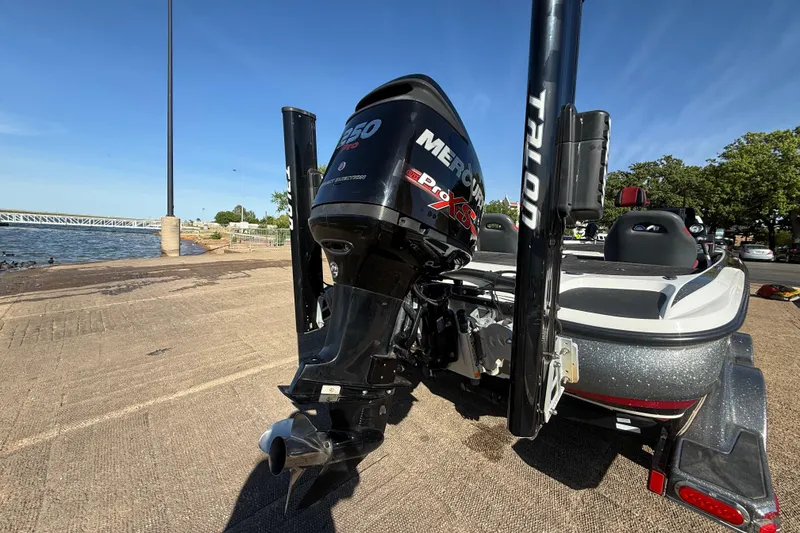 Slide: The Image of 2016 Nitro Z21 boat with Mercury 250 Pro XS engine at a lakeside dock. - 37