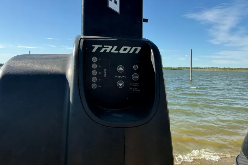 Slide: The Image of Talon control panel on a 2016 Nitro Z21 boat by the water. - 39