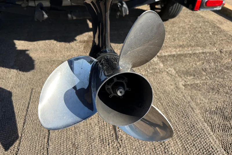 Slide: The Image of Close-up of a 2016 Nitro Z21 boat propeller on a textured surface. - 41