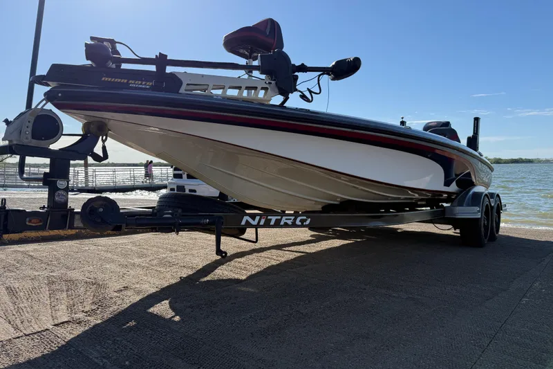 Slide: The Image of 2016 Nitro Z21 boat on trailer by the water, ready for launch. - 53