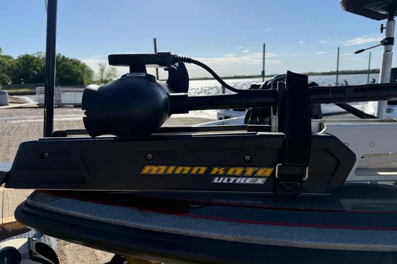 Slide: The Image of Minn Kota Ultrex trolling motor on 2016 Nitro Z21 boat by the water. - 55