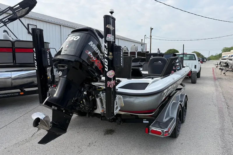 Slide: The Image of 2016 Nitro Z21 boat with Mercury engine on trailer, parked outdoors. - 9