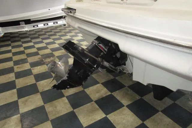 Slide: The Image of Rear view of a 2000 Sea Ray 210 Signature boat on checkered floor. - 16