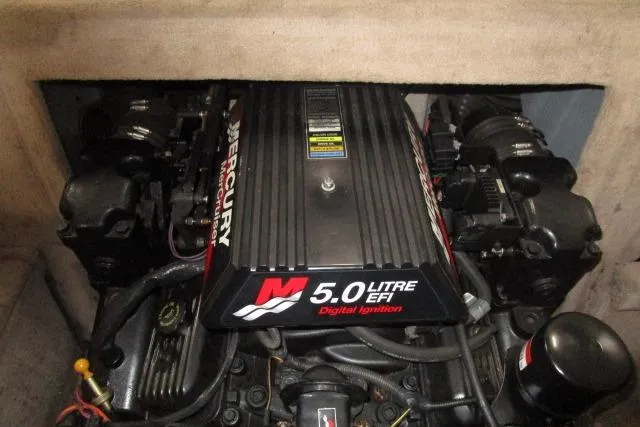 Slide: The Image of Engine of a 2000 Sea Ray 210 Signature boat, featuring a 5.0 Litre EFI Mercury motor. - 17
