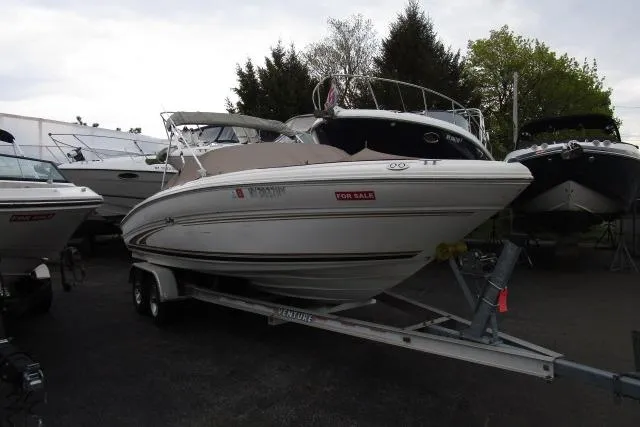 The Image of 2000 Sea Ray 210 Signature boat on trailer, for sale in a marina. - 18