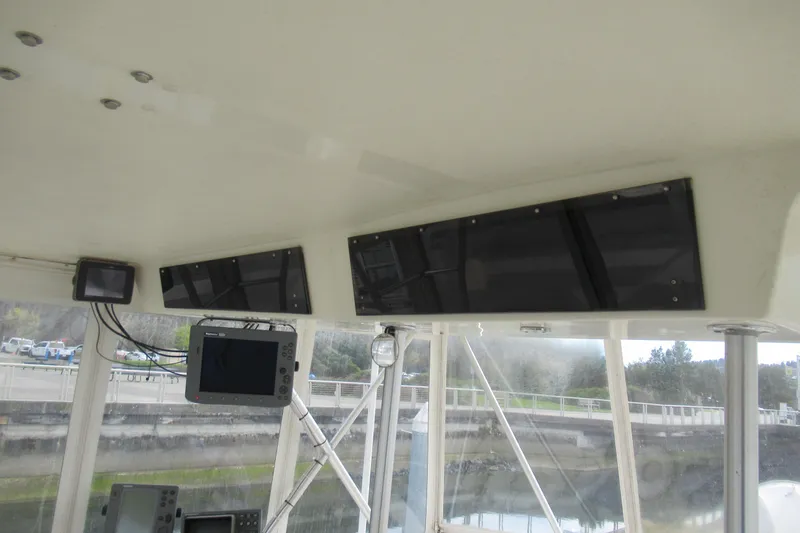 Slide: The Image of Interior view of a 1990 Viking 38 Convertible boat's helm with navigation equipment. - 20