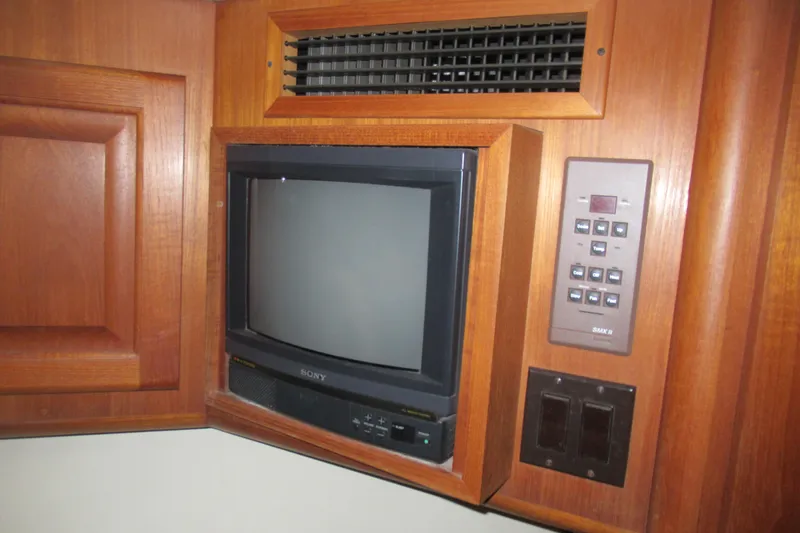 Slide: The Image of Vintage Sony TV and control panel in 1990 Viking 38 Convertible yacht interior. - 38