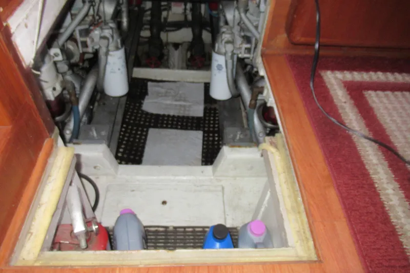 Slide: The Image of Engine compartment of a 1990 Viking 38 Convertible boat, showing maintenance supplies. - 41